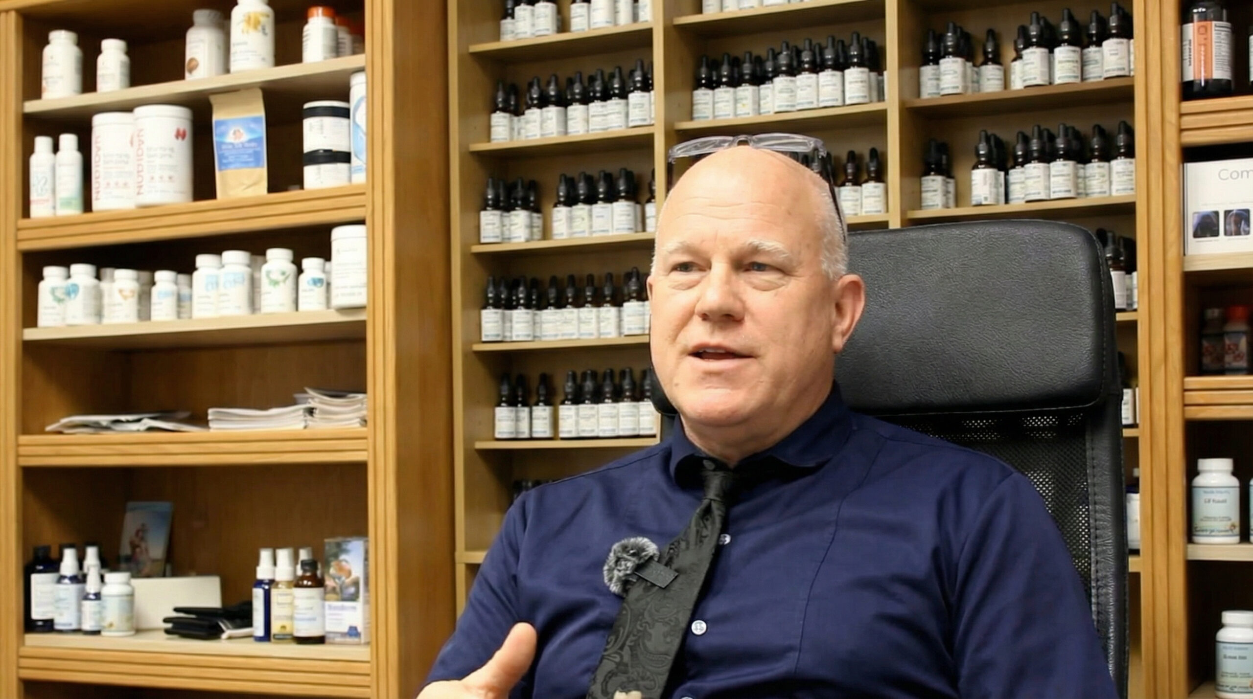 Dr. Paul Robbins performing biofeedback therapy at Natural Wellness Clinic in The Woodlands TX